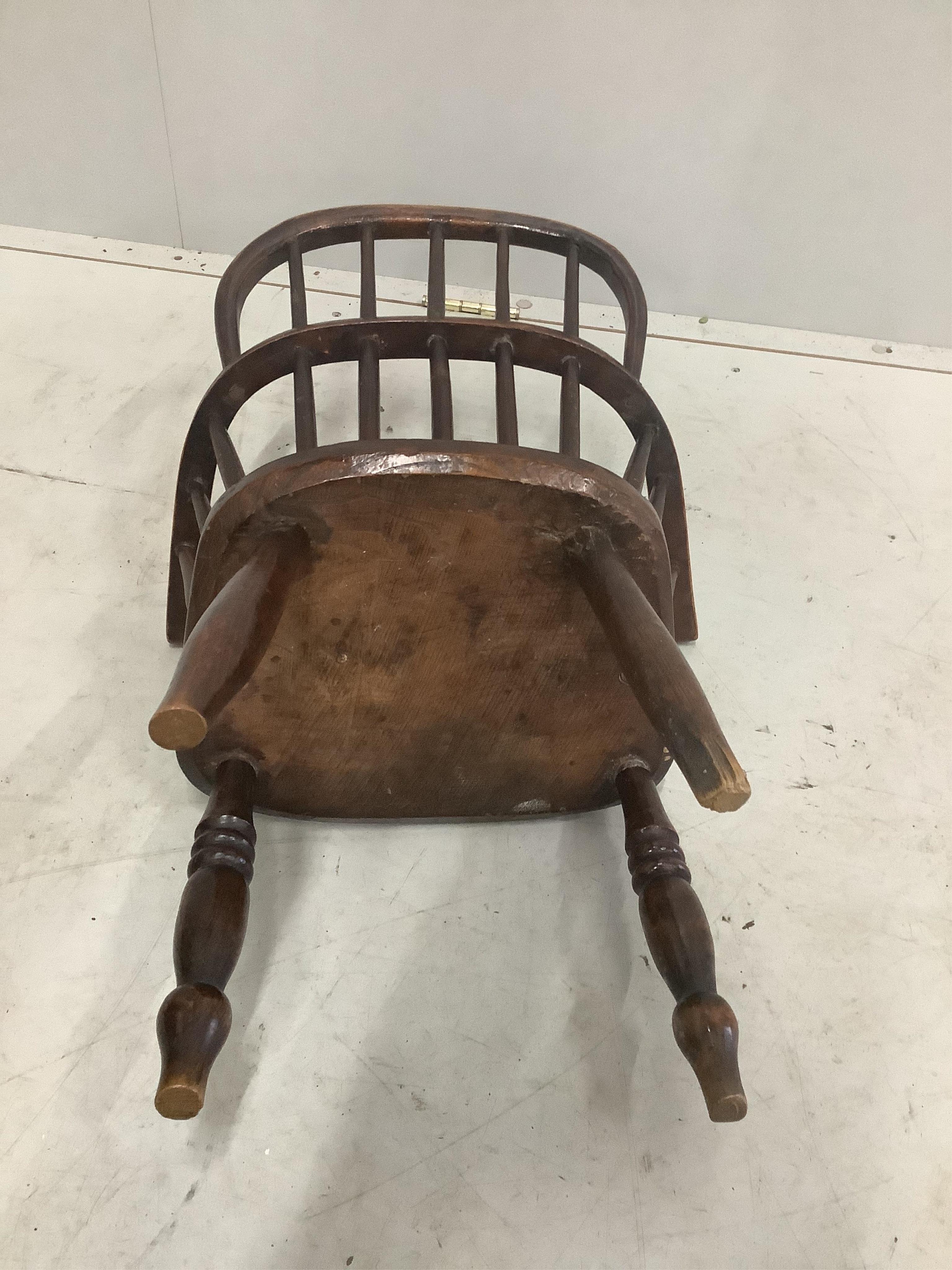 A Victorian ash and elm Windsor child's elbow chair, width 43cm, depth 28cm, height 60cm. Condition - fair